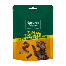 Natures Menu dog treat package with green and yellow design, featuring a dog and text about meaty treats.