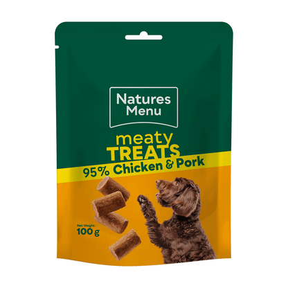 Natures Menu dog treat package with green and yellow design, featuring a dog and text about meaty treats.