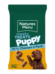 Natures Menu puppy treats packaging with a green top and yellow bottom, featuring chicken and pork.