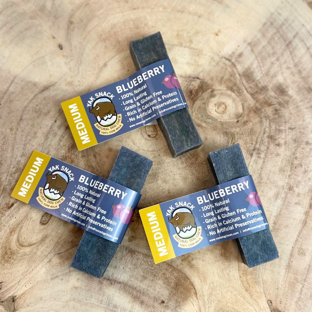 Yak Snacks Blueberry bars with labels on a wooden surface