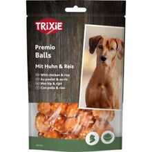 Trixie Premio Balls dog treat package with a dog photo and text on a brown background